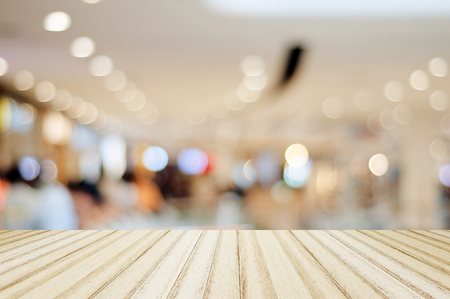 Wood floor and blurred shopping mall backgroundの写真素材