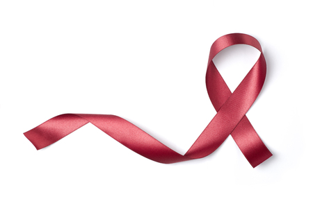 Red ribbon isolated on white background Photo object for sign world aids dayの写真素材