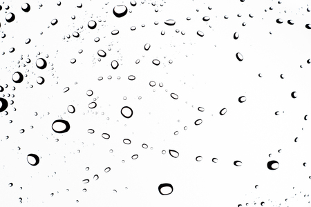 Water drop on glass on white backgroundの写真素材