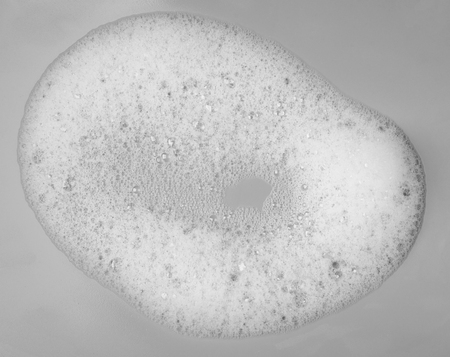 Foam bubble on gray background on top view object beatuy health care concept designの写真素材