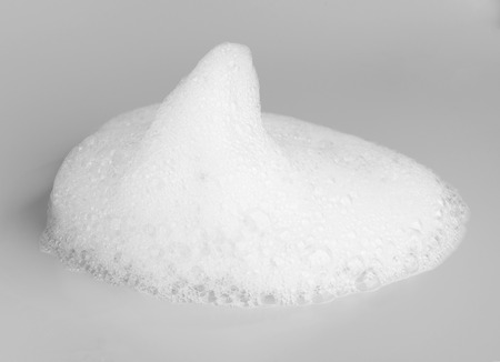 Soap foam bubble isolated on gray background object beatuy health care conceptの写真素材
