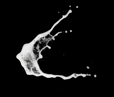 White bubble foam splash explosion in the air on black background,freeze stop motion photo object designの写真素材