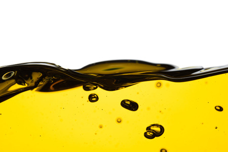 Pouring oil car motor or olive vegetable cooking and bubble isolated on white backgroundの写真素材