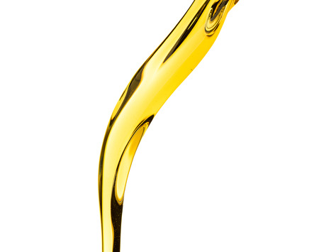 Pouring splash oil car motor or vegetable olive isolated on white background photo object designの写真素材