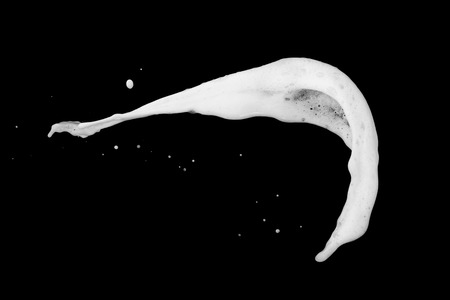 White bubble foam splash explosion in the air on black background,freeze stop motion photo object designの写真素材