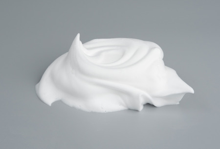Shaving foam or cream bubble isolated on gray background object beauty health care product design conceptの写真素材