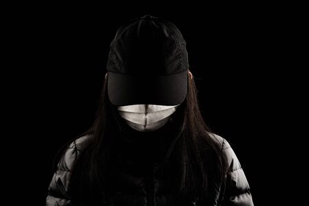 Female wear face mask beware protect virus carona covic 19 dust pollution on black background