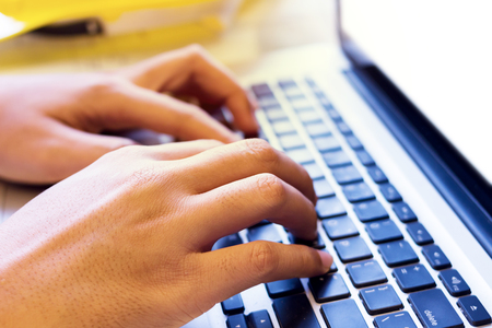 Hands of architects working project on laptop computer  on the site office,start a business plan ideas.の写真素材