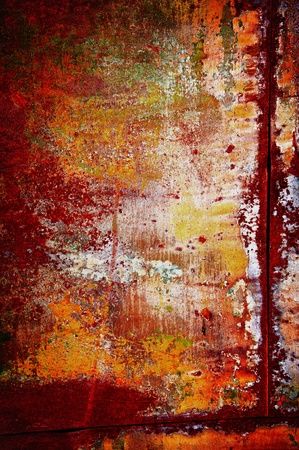 Red-yellow colors of a rust with a shabby colourful coveringの写真素材