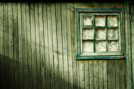 Wooden wall of green color, with a square window Vintageの写真素材