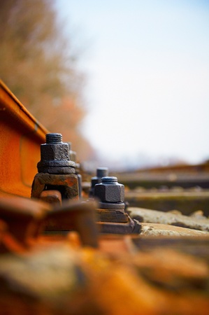 Fixing rusty rails to a cross tie black boltsの写真素材