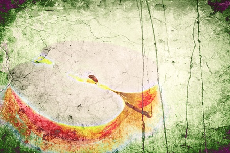 Art grunge a background. The cut off piece of an apple on an old wall of green colorの写真素材