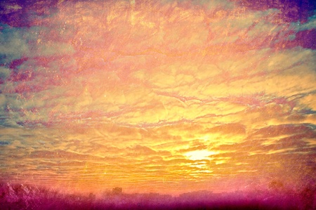 Art background in style grunge. Yellow clouds on sunset.