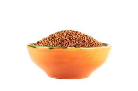 buckwheat in pottery isolated on white backgroundの写真素材