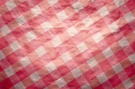 It is a texture of an old paper in red cell. A background in style of a retroの写真素材