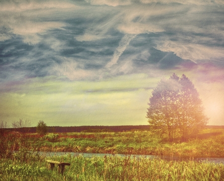 Sky field landscape on a textured vintage paper backgroundの写真素材