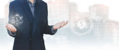 Asian businessmen with various icon of investment on bright and blurred city scape background. Concept business and investmentの写真素材