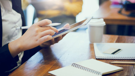 Young female using digital tablet to payment and shopping online by credit card