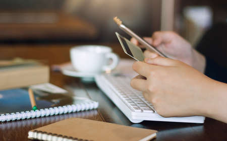 Businesswoman using mobile phone to payment or shopping online with credit cardの写真素材