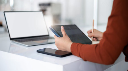focus on hand young asian businesswoman using mobile app from digital tablet working and meeting...