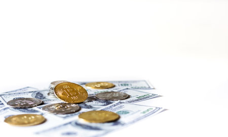 Focus on golden coin with silver coin and dollar on white background. Concept invest in cryptocurrencyの写真素材