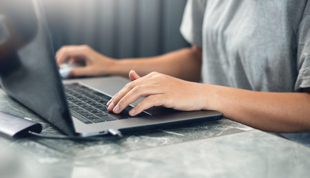 Focus on hand, Young asian woman using computer laptop working at home or cafe. concept people work...
