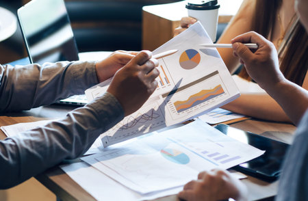 Business concept. Business people discussing the charts and graphs about investment and business...