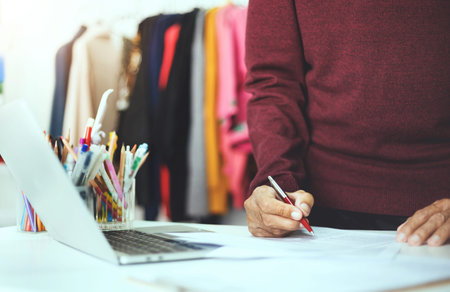 Asian man working at home and start new business online via mobile phone to recommend products to...