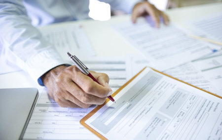 Close-up shot, asian businessman working at office and review document report. legal expert,...