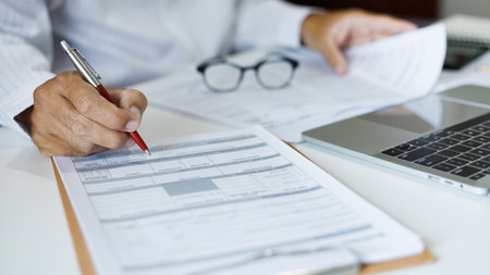 asian businessman reviewing document at office. legal expert, professional lawyer working with...