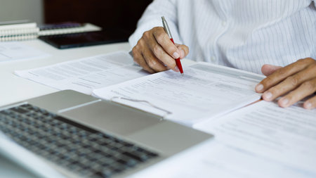 asian businessman reviewing document at office. legal expert, professional lawyer working with...