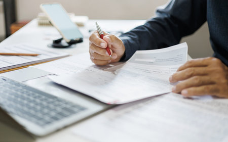 close-up shot, hand of businessman reviewing document at office. legal expert, professional lawyer...