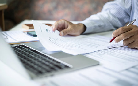close up shot, asian businessman using laptop working and meeting online with business group...
