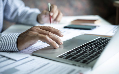 close up shot, asian businessman using laptop working and meeting online with business group checking documents, business contract and make business planの写真素材