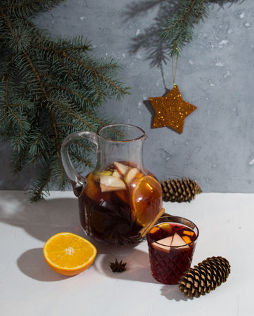 Glintwein in a glass of cinnamon and in the background mulled wine in the countess next to lie orange and badyanの写真素材
