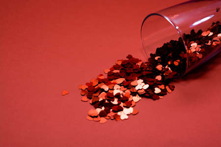 Confetti on a red background.の写真素材