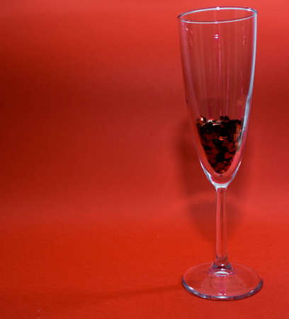 Ring and confetti in a champagne glassの写真素材