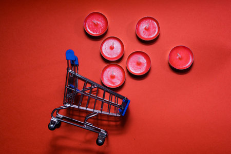 Red candles in the shopping carの写真素材