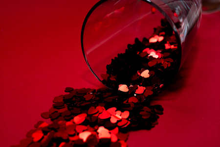 Confetti on a red background.の写真素材