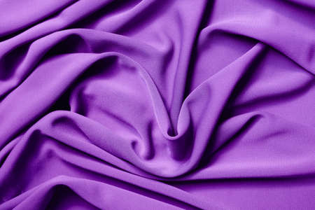 Smooth elegant violet satin texture can use as abstract background. Luxurious background design. Closeup purple textureの写真素材