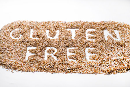 oat seeds in a black plate isolated on white background top viewの写真素材