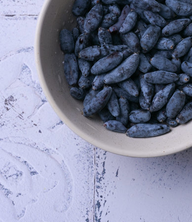 Close-up macro shot of honeysuckle berries. Healthy blue edible berries, rich in antioxidants and vitamins.の写真素材