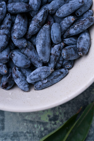 Close-up macro shot of honeysuckle berries. Healthy blue edible berries, rich in antioxidants and vitamins.の写真素材