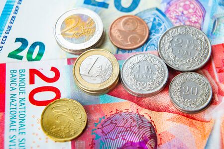 Euro and Swiss Francs coins and banknotesの写真素材