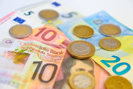 Euro and Pound coins and banknotesの写真素材