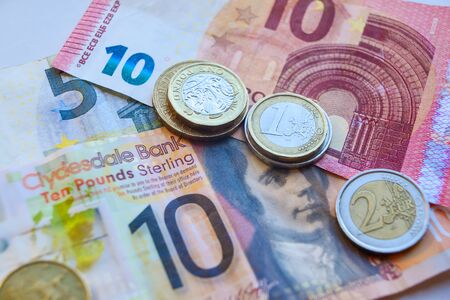 Euro and Pound coins and banknotesの写真素材