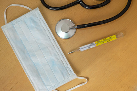 Mask, thermometer and stethoscope