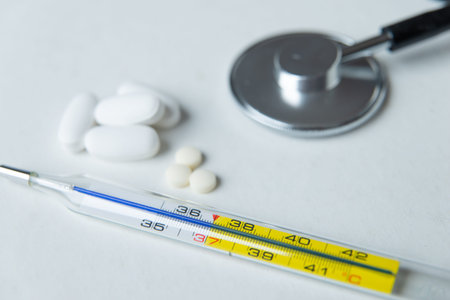 Stethoscope, tablets and thermometer