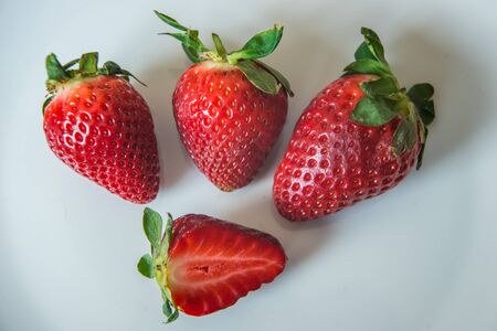 Strawberries on a white plateの写真素材