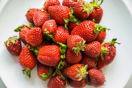 Strawberries on a white plateの写真素材